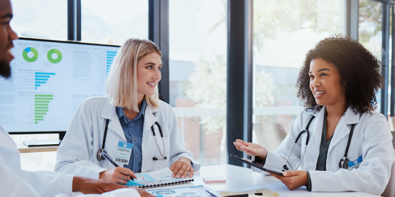 Physicians talking around a table