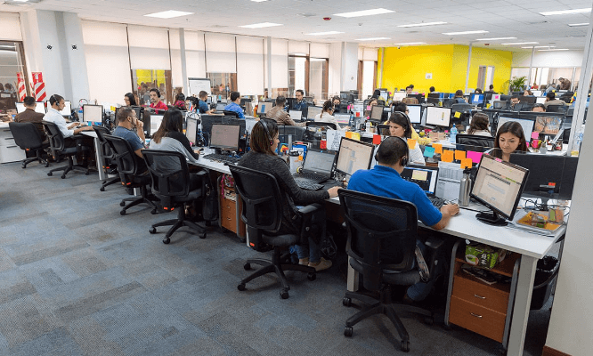 Auxis’ San José, Costa Rica employees working on their computers